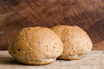 Whole wheat bread on wooden background,meal or breakfast