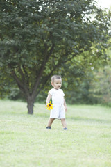 Cute Chinese baby boy playing in a park