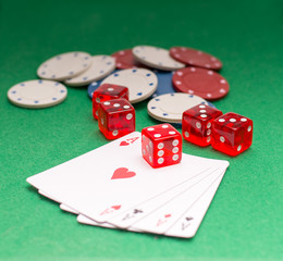 aces chips cubes on a green background