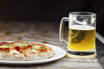 Tasty Pepperoni Pizza And Cold Mug Of  Beer On Black Background