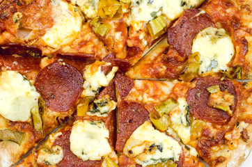 Obraz na płótnie Canvas Tasty Pepperoni Pizza With Blue Cheese Close Up