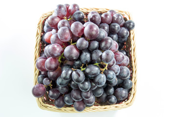 Grapes in baskets isolated on white background