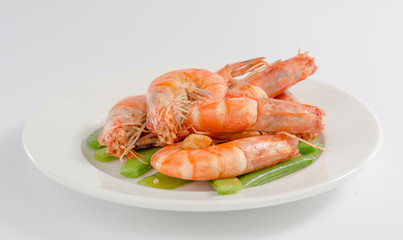Fried shrimp in a plate isolated on white background