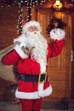 Santa Claus with bell announces his arrival