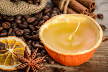 Christmas decoration . Coffee beans, candle, orange, anise