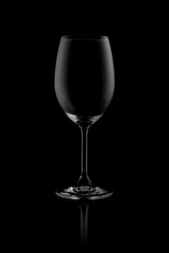 empty wine glass isolated on dark background