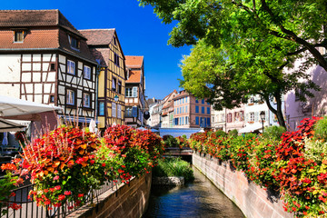  beautiful places of France - colorful Colmar town in Alsace region - obrazy, fototapety, plakaty