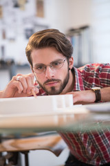 Closeup, portrait of a young architect working on a building pro