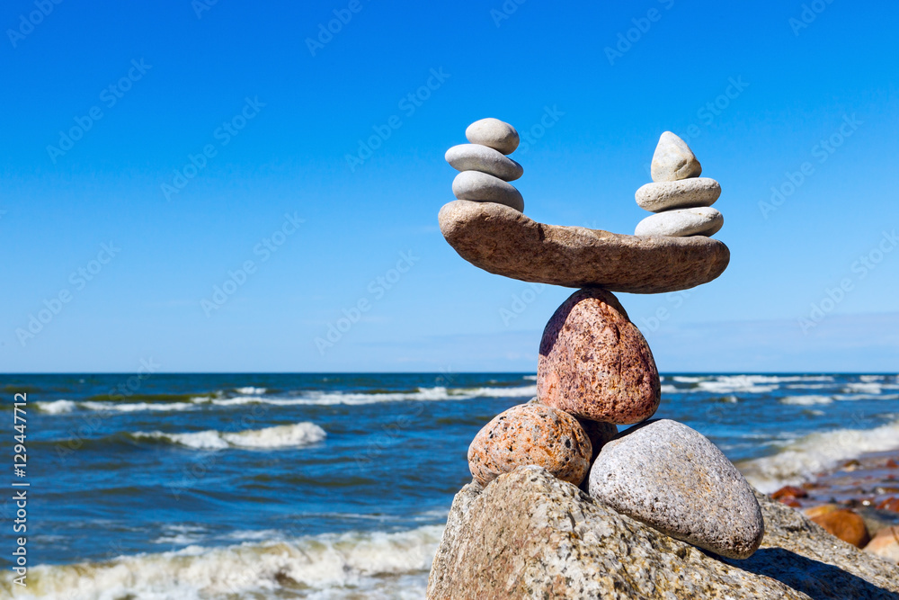 Wall mural concept of harmony and balance. balance stones against the sea.