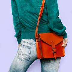 Stylish look. Trendy green sweater and red bag Stylish Girl Outf