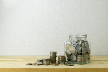 Money saving in the glass bottle for money concept