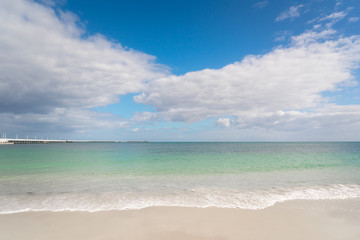 Fototapeta na wymiar Tropical beach, with clear water in the background. Clear blue sky. Busselton, Western Australia.