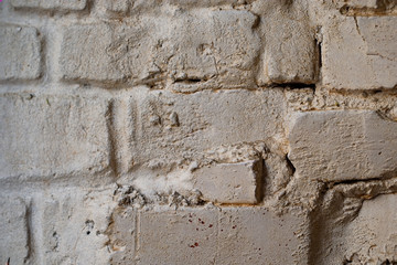 Whitewashed old brick wall background. Grid uneven bricks. Interior and exterior urban loft design. Horizontal