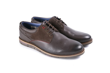 male shoes in brown leather on white background, isolated product, top view