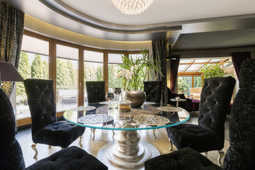 Luxurious dining room with glass table