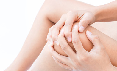 Closeup woman hand hold knee with pain symptom, health care anb