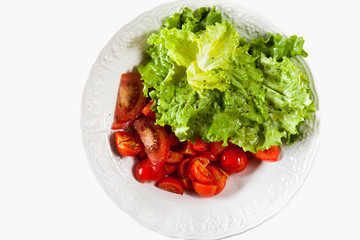 resh Lettuce and Tomatoes Salad in a bowl isolated on white
