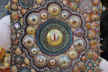 Obraz na płótnie Canvas the art design of the colorful broken tile, bead, bowl lid and stone decorating for abstract art interior wallpaper