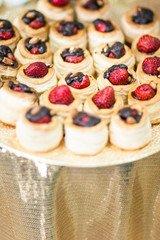 Assortment of Fresh Pastry on Table with Flowers