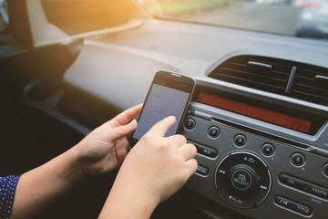 woman using map on smartphone.navigation in the car. gps on mobi