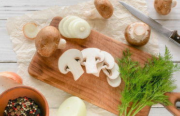 broken half pita bread caucasian, lying on a cutting board. Light wood background.