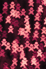 Abstract bokeh background with Christmas cookie men 