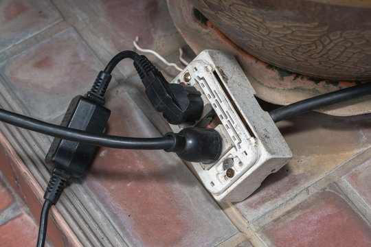 power socket with many cables plugged in
