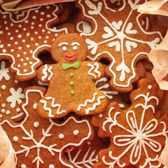 Closeup of gingerbread man cookie and snowflakes cookies 
