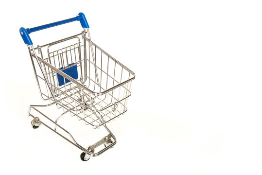 Empty shopping pushcart seen from above with room for text on a white background