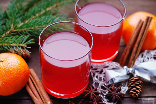 Hot mulled wine with spices, mandarin and bow