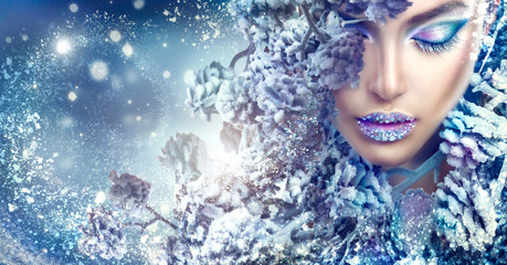 Christmas beauty girl. Winter holiday makeup with gems on lips