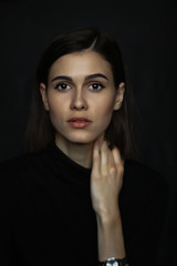 Portrait of woman on black background