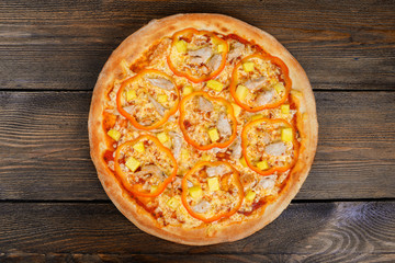 Delicious italian pizza served on wooden table