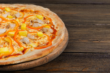 Delicious italian pizza served on wooden table