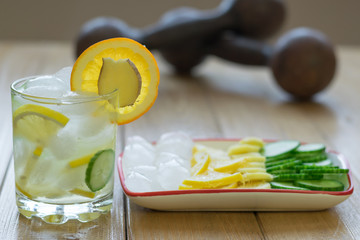 Cold water with lemon, ginger, orange and cucumber.