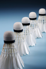 Badminton shuttlecocks in row