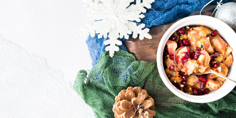 Christmas baked apple dessert with pomegranate. Flat lay banner