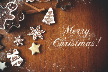 Christmas cookies on a dark table, top view with Merry Christmas message