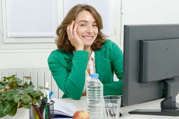 Portrait of a young business woman with  green jacket