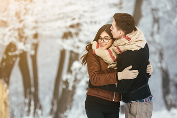 Happy couple in snow park