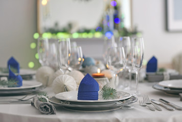 Table served for Christmas dinner in living room, close up view