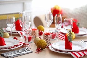 Table served for Christmas dinner in living room, close up view