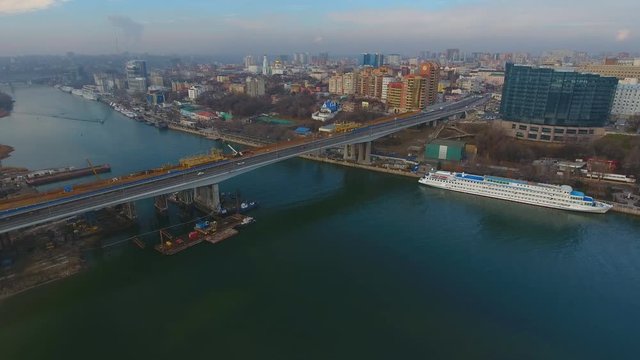 Construction of the bridge across the river. Aerial view.