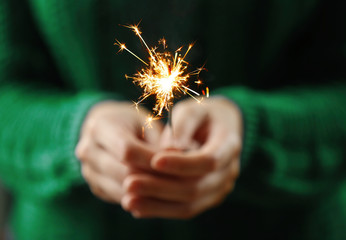 Close up view of hands with sparkler