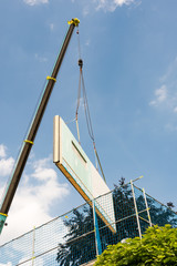 Fototapeta premium Assembling a prefabricated house