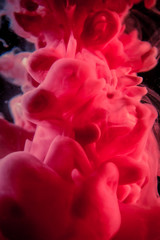 
The red dye in the water. Abstract background. Wallpaper. Concept art