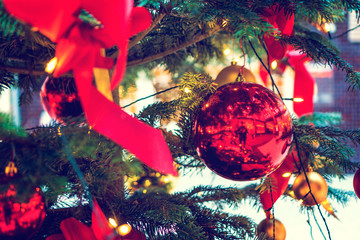 Red Christmas ball and loop on fir tree