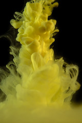 The yellow dye in the water. Abstract background. Wallpaper. Concept art