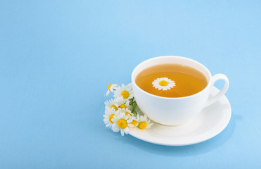 Cup of tea and chamomiles
