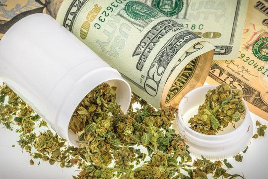 Marijuana buds on money